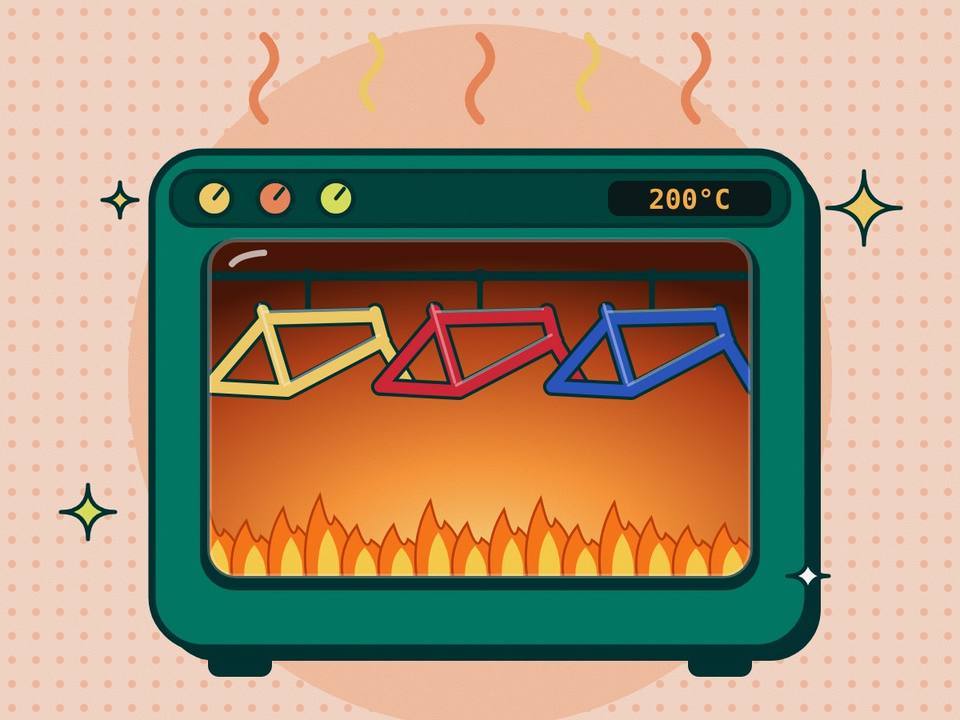 Horno de pintura con cuadros de bicicleta de colores colgados