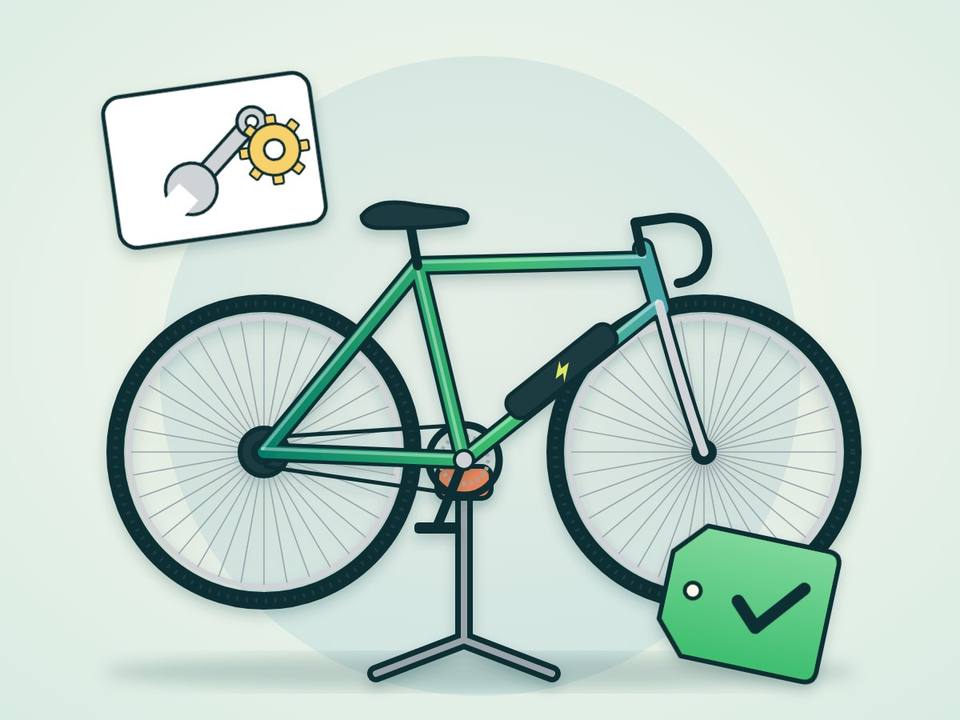 Bicicleta eléctrica en un soporte de taller con herramientas